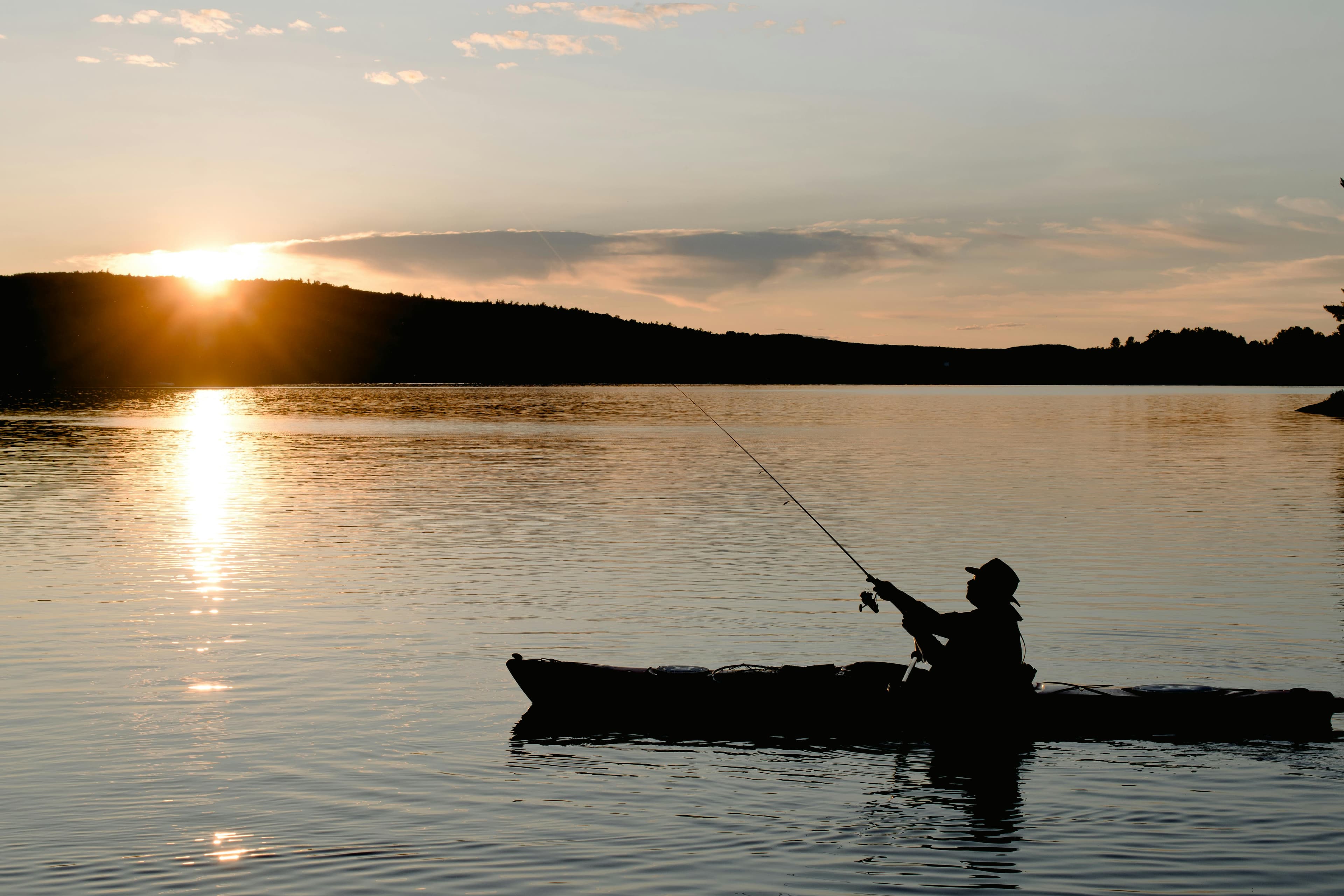 Best kayak fishing lights for night fishing laid out on a kayak deck