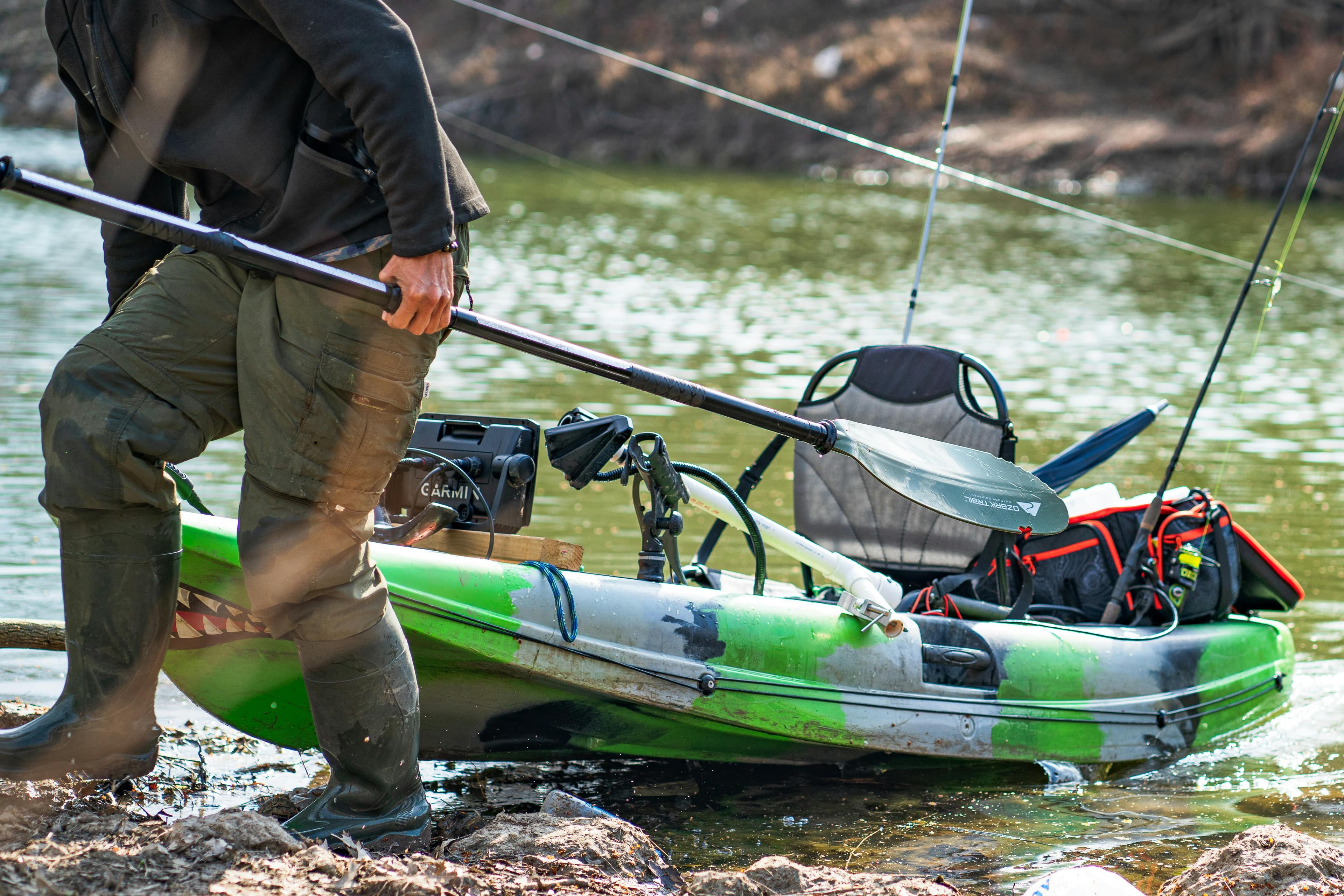 Waterproof dry bags sitting on a kayak deck ready for a fishing trip