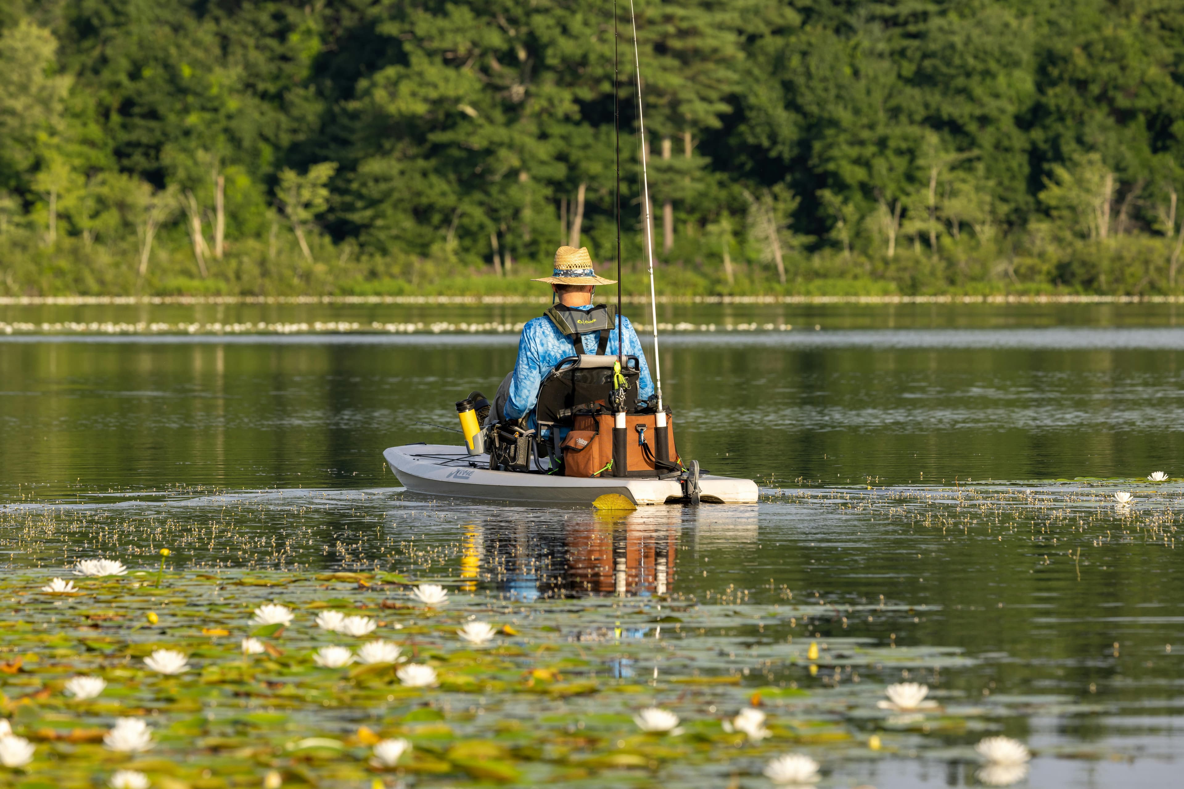 Flush mount and track-mount rod holders rigged on a fishing kayak deck